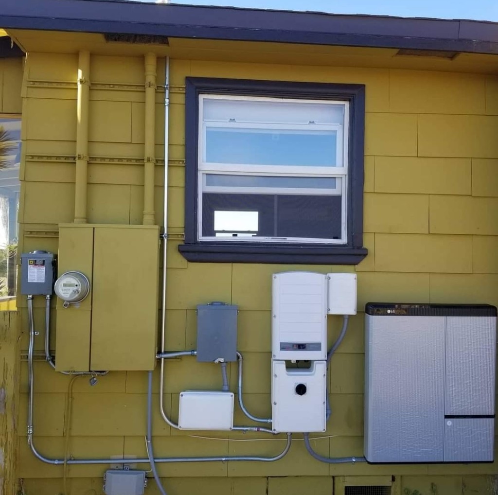 LG Chem battery and SolarEdge inverter installed on a home exterior wall