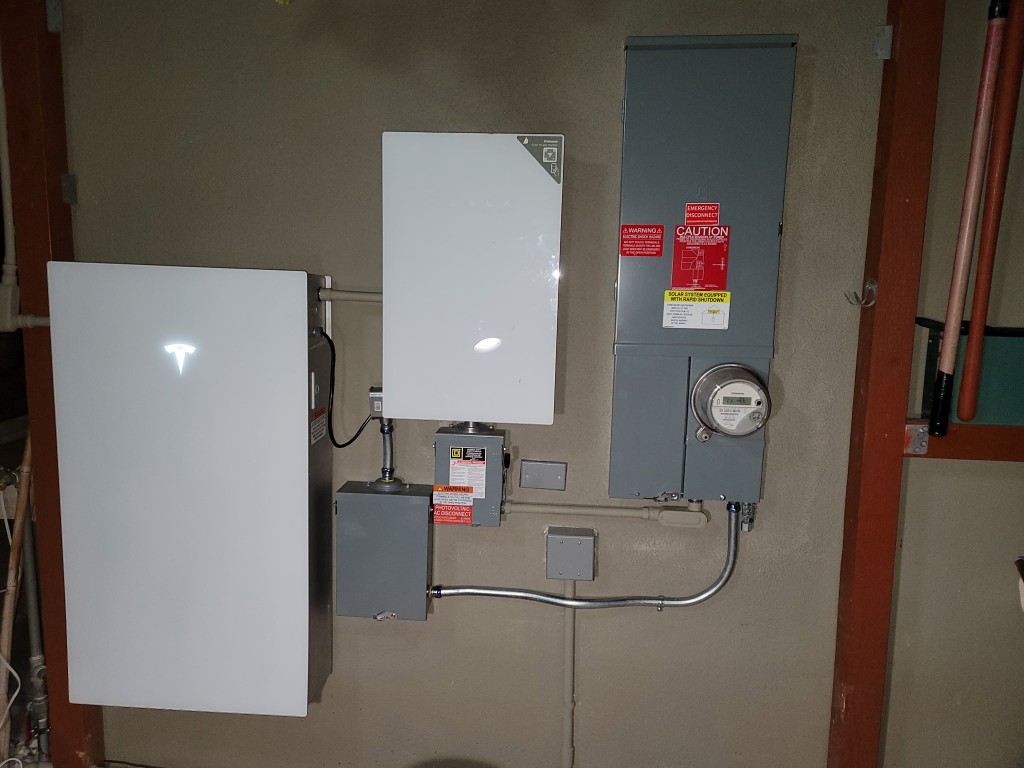 Tesla Powerwall with gateway, disconnects, and utility meter
