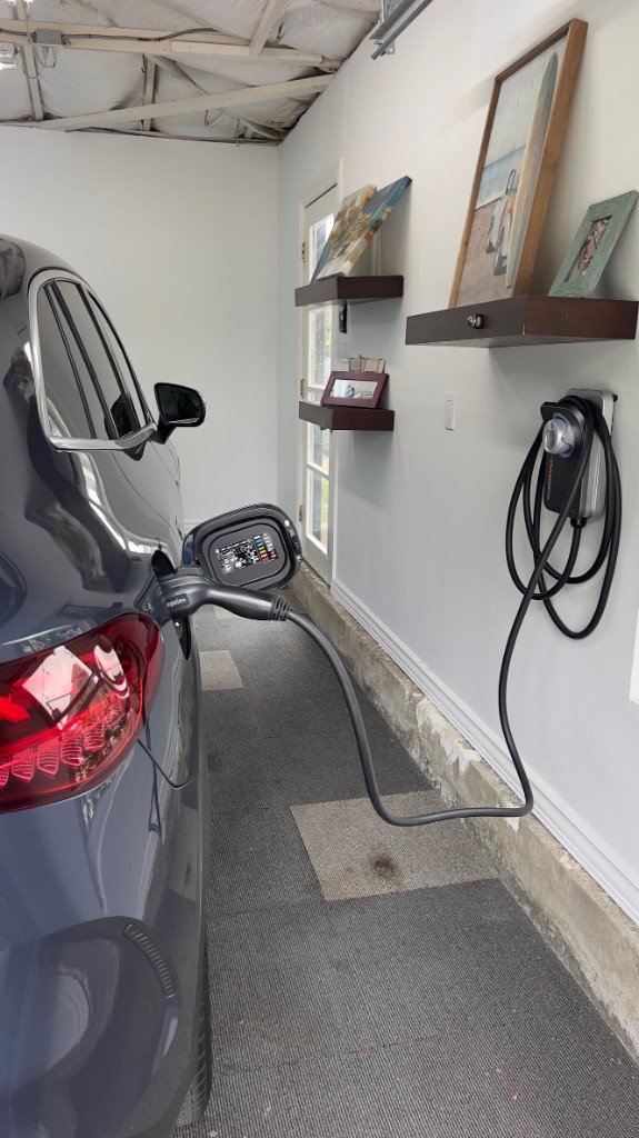 ChargePoint Home Flex installed in a garage charging a Mercedes-Benz SUV