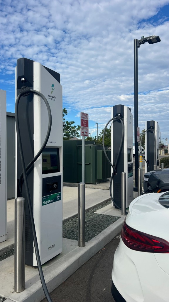 Electrify America hyper-fast EV charging stations in a parking lot