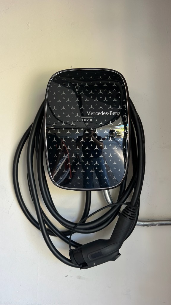 Mercedes-Benz Wallbox EV charger mounted on a garage wall
