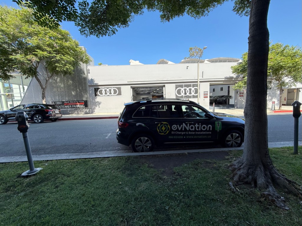 evNation branded service vehicle parked at Audi Beverly Hills dealership