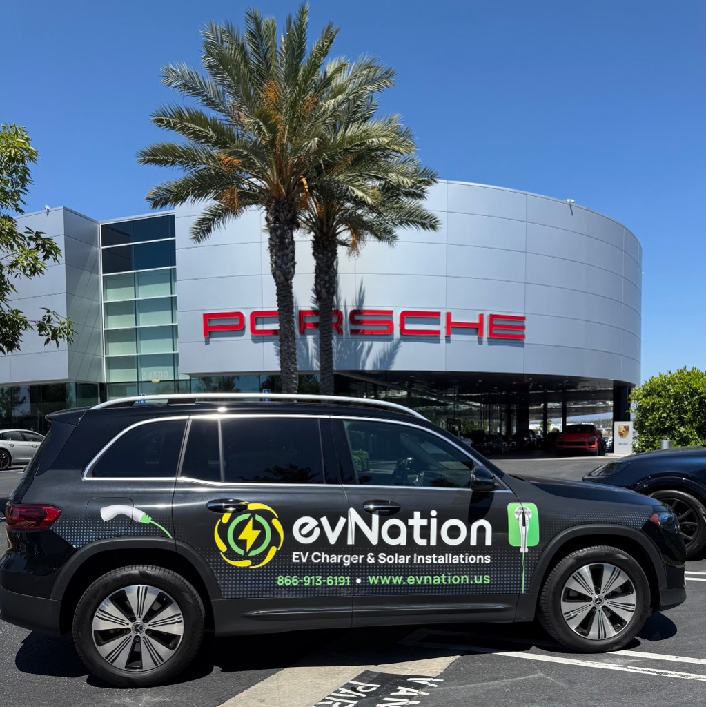 evNation branded service vehicle in front of a Porsche dealership